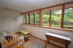 Seating area with plenty of light in lower level queen bedroom 